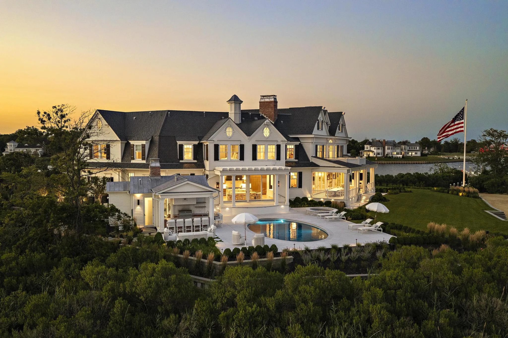 Exterior dusk at American Dream, a Merrick Construction custom home in Rumson, New Jersey
