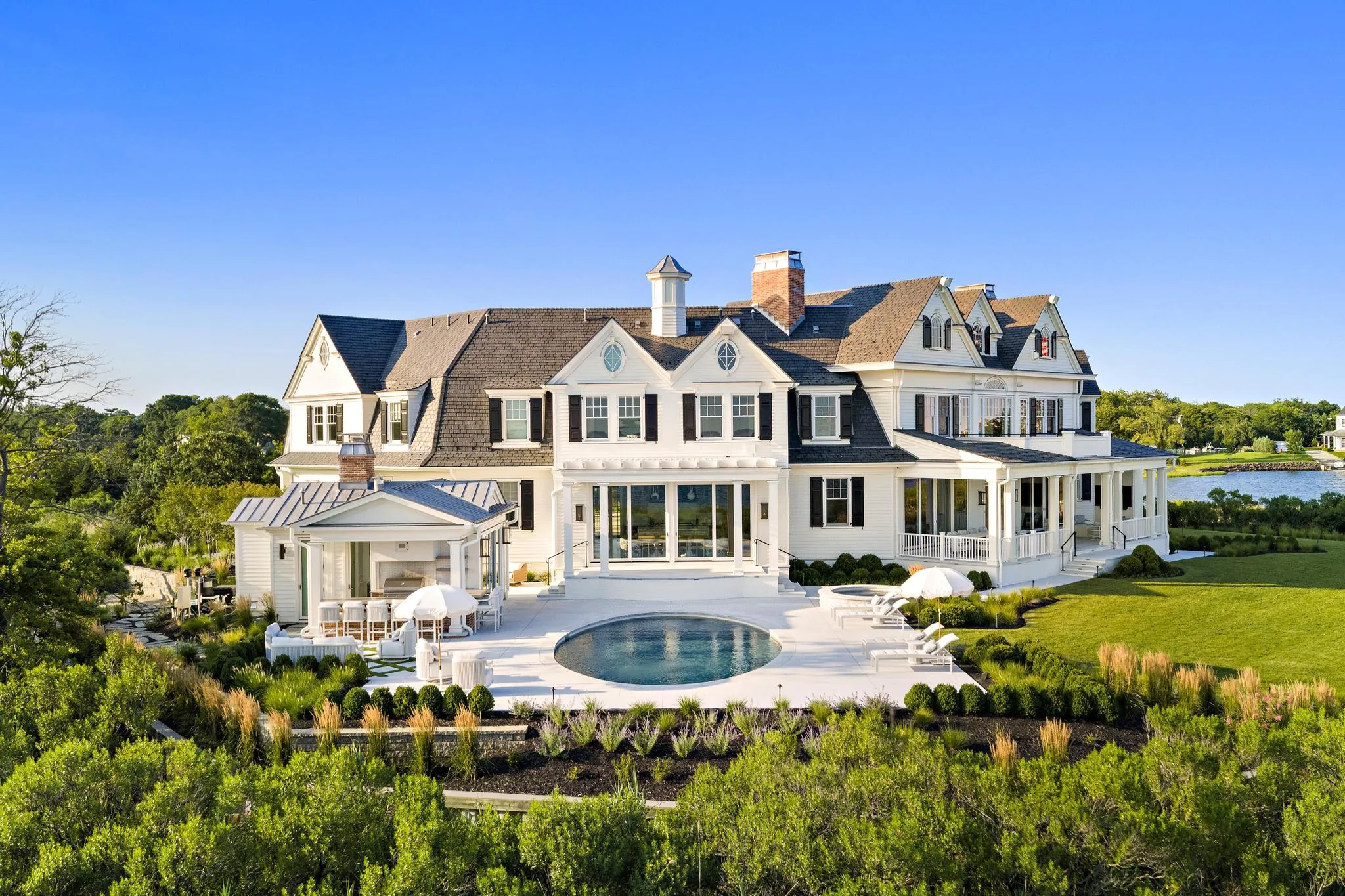 Exterior pool at American Dream, a Merrick Construction custom home in Rumson, New Jersey