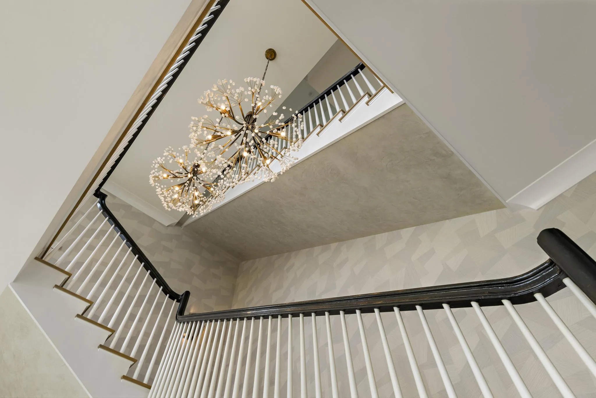 Staircase at American Dream, a Merrick Construction custom home in Rumson, New Jersey
