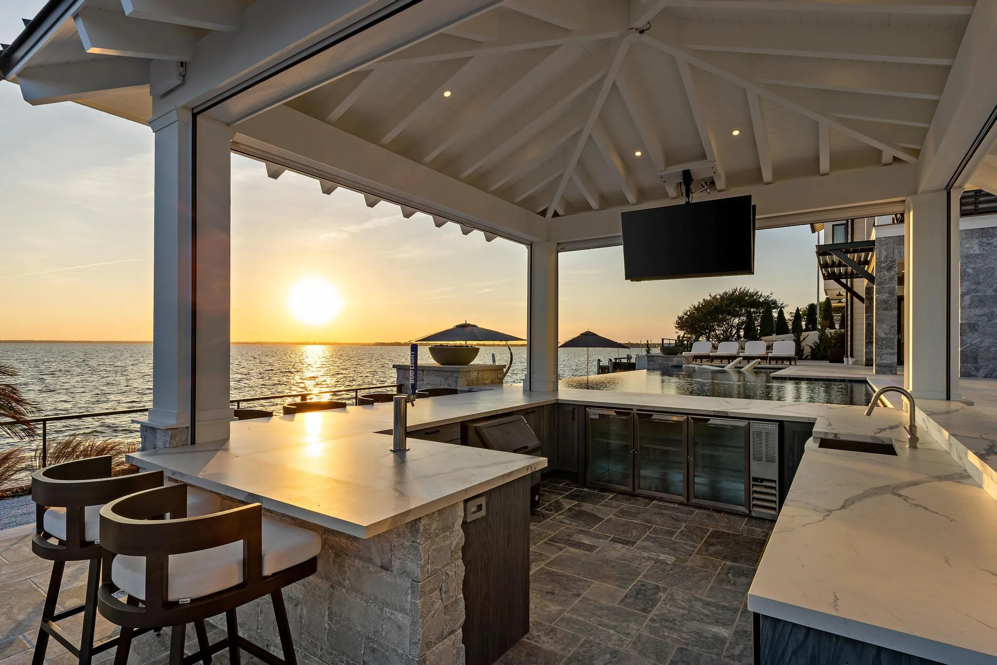 Outdoor kitchen at The Fun Starts Here, a Merrick Construction custom home in Brick, New Jersey